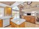 Kitchen featuring tile floors, arched window, and access to backyard pool at 1877 Glory Lily Ct, Las Vegas, NV 89123