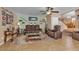Spacious living room with plush seating, ceiling fan, and open access to the staircase at 1877 Glory Lily Ct, Las Vegas, NV 89123