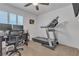 Office space featuring a treadmill, desk, and natural light at 1877 Glory Lily Ct, Las Vegas, NV 89123