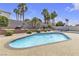 Backyard oasis boasts a private pool surrounded by lush landscaping and mature palm trees, perfect for relaxation at 1877 Glory Lily Ct, Las Vegas, NV 89123