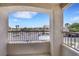 Balcony with stucco frame and view of the parking lot and desert landscape at 1881 W Alexander Rd # 2093, North Las Vegas, NV 89032