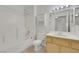 This well-lit bathroom offers a shower-tub combination, a vanity with storage, and a mirrored medicine cabinet at 1881 W Alexander Rd # 2093, North Las Vegas, NV 89032