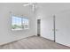 This bright bedroom features plush carpet, a ceiling fan, and a closet for ample storage space at 1881 W Alexander Rd # 2093, North Las Vegas, NV 89032