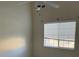 Bright bedroom with ceiling fan and natural light from window at 1881 W Alexander Rd # 2093, North Las Vegas, NV 89032