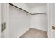 Walk-in closet with carpeted floor and closet rod with shelf for optimal storage space at 1881 W Alexander Rd # 2093, North Las Vegas, NV 89032