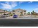 Attractive two-story building featuring a balcony and convenient parking spaces at 1881 W Alexander Rd # 2093, North Las Vegas, NV 89032