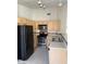 A bright kitchen featuring stainless steel appliances and ample counter space at 1881 W Alexander Rd # 2093, North Las Vegas, NV 89032