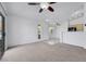 Inviting living room featuring a sliding glass door, carpet, and tile flooring at 1881 W Alexander Rd # 2093, North Las Vegas, NV 89032