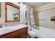 Bathroom featuring a tub and shower combination, decorative tile, and updated fixtures at 2035 E Warm Springs Rd # 1019, Las Vegas, NV 89119