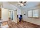 Bedroom featuring wood floors, a ceiling fan, and a built-in desk and workstation at 2035 E Warm Springs Rd # 1019, Las Vegas, NV 89119