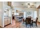 Cozy dining area featuring wood floors, a round table, and stylish decor adjacent to a kitchen bar and breakfast nook at 2035 E Warm Springs Rd # 1019, Las Vegas, NV 89119
