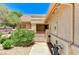 Home exterior featuring an iron gate and covered entry way at 2035 E Warm Springs Rd # 1019, Las Vegas, NV 89119