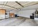 Spacious garage with overhead lighting, built in storage, work bench, and a utility sink at 2035 E Warm Springs Rd # 1019, Las Vegas, NV 89119