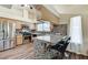 Modern kitchen boasting stainless steel appliances, granite countertops, mosaic backsplash, and breakfast bar seating at 2035 E Warm Springs Rd # 1019, Las Vegas, NV 89119