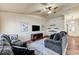 Open living room featuring hardwood floors, neutral walls, and comfortable couches at 2035 E Warm Springs Rd # 1019, Las Vegas, NV 89119
