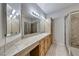 Bathroom featuring a spacious vanity countertop, storage cabinets and glass enclosed shower at 2050 W Warm Springs Rd # 4021, Henderson, NV 89014