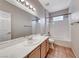 Bathroom featuring a large mirror, single sink vanity, and tub/shower combination at 2050 W Warm Springs Rd # 4021, Henderson, NV 89014