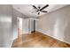 Bedroom with hardwood floors and ceiling fan with a closet in the background at 2050 W Warm Springs Rd # 4021, Henderson, NV 89014