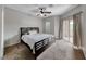 Comfortable bedroom featuring a ceiling fan and sliding glass door access to a patio or balcony at 2050 W Warm Springs Rd # 4021, Henderson, NV 89014