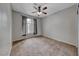 Bedroom with neutral walls, carpeted floor and a window dressed with curtains at 2050 W Warm Springs Rd # 4021, Henderson, NV 89014