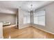 Inviting dining space with hardwood flooring, modern lighting, and large windows at 2050 W Warm Springs Rd # 4021, Henderson, NV 89014