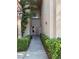 Inviting walkway leading to the front door with manicured landscaping at 2050 W Warm Springs Rd # 4021, Henderson, NV 89014