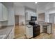 Modern kitchen equipped with stainless steel appliances and ample cabinet space at 2050 W Warm Springs Rd # 4021, Henderson, NV 89014