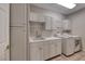 Laundry room with white cabinets, countertop space, a sink and a washer and dryer at 2050 W Warm Springs Rd # 4021, Henderson, NV 89014