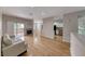 Open-concept living area features hardwood floors and a cozy fireplace at 2050 W Warm Springs Rd # 4021, Henderson, NV 89014