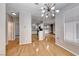 Open floor plan with hardwood floors connecting the living, dining, and kitchen areas at 2050 W Warm Springs Rd # 4021, Henderson, NV 89014
