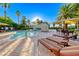 Beautiful community pool area with lounge chairs and well-manicured landscaping with palm trees at 2050 W Warm Springs Rd # 4021, Henderson, NV 89014
