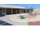 A spacious backyard with a large patio and a decorative pergola at 2201 E Dandelion St, Pahrump, NV 89048