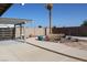 Backyard with landscaping, gravel, and a covered patio area at 2201 E Dandelion St, Pahrump, NV 89048