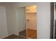 Walk-in closet featuring open storage and mirror sliding doors at 2201 E Dandelion St, Pahrump, NV 89048