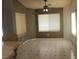 Bright dining area with large windows and a ceiling fan at 2201 E Dandelion St, Pahrump, NV 89048