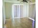 Bright living room featuring tile floors and vertical blinds on the windows at 2201 E Dandelion St, Pahrump, NV 89048