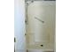 Shower featuring built-in seats, shower head, grab bar, and neutral tile at 2201 E Dandelion St, Pahrump, NV 89048