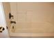 Tile shower and tub combo with a bronze shower head at 2201 E Dandelion St, Pahrump, NV 89048