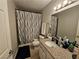 Bathroom featuring a shower-tub combo, and a granite countertop vanity at 2451 N Rainbow Blvd # 1123, Las Vegas, NV 89108