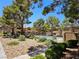 Community pool surrounded by greenery and seating at 2451 N Rainbow Blvd # 1123, Las Vegas, NV 89108