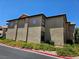 Apartment building exterior with stucco walls, tile roof, and flowering bushes at 2451 N Rainbow Blvd # 1123, Las Vegas, NV 89108