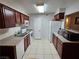 Efficient kitchen features white appliances, ample counter space, and tile flooring at 2451 N Rainbow Blvd # 1123, Las Vegas, NV 89108