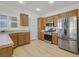 Modern kitchen featuring stainless steel appliances, wood cabinets, and plenty of counter space at 2548 Leighton Ave, Henderson, NV 89052