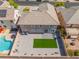 A bird's-eye view displays a backyard featuring a pool and artificial turf at 2625 Cattrack Ave, North Las Vegas, NV 89081
