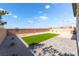 A low-maintenance backyard features artificial turf, a gravel border, and a paved patio area at 2625 Cattrack Ave, North Las Vegas, NV 89081