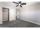 The bedroom has gray carpet, a ceiling fan, a closet with sliding doors and an open door at 2625 Cattrack Ave, North Las Vegas, NV 89081