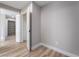 A simple walk-in closet features wood style floors, ample shelving, and an open design, ready for organized storage at 2625 Cattrack Ave, North Las Vegas, NV 89081