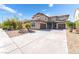 Charming two-story home boasting a three-car garage and desert-style landscaping at 2625 Cattrack Ave, North Las Vegas, NV 89081