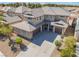 View of the home featuring a desert landscape, a two-car garage, and a neutral color palette at 2625 Cattrack Ave, North Las Vegas, NV 89081