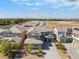 A two-story home with neutral colors features a tile roof and well-maintained landscaping, with a mountain view in the distance at 2625 Cattrack Ave, North Las Vegas, NV 89081